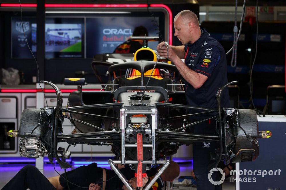 A mechanic works on the car of Max Verstappen, Red Bull Racing RB19 