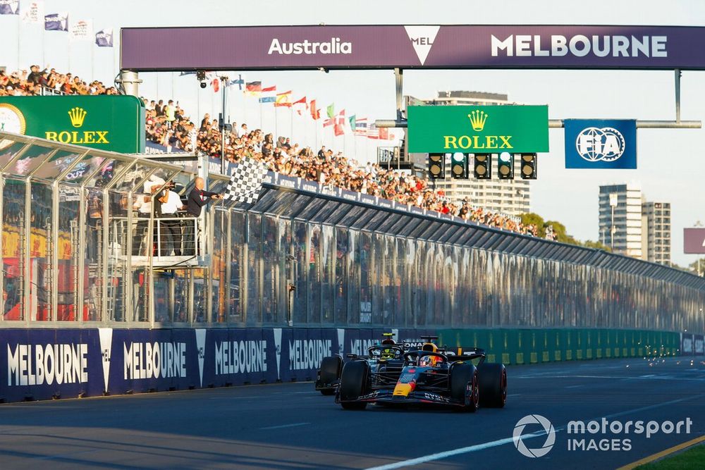 Max Verstappen, Red Bull Racing RB19, 1st position, leads Sir Lewis Hamilton, Mercedes F1 W14, 2nd position, as the chequered flag is waved
