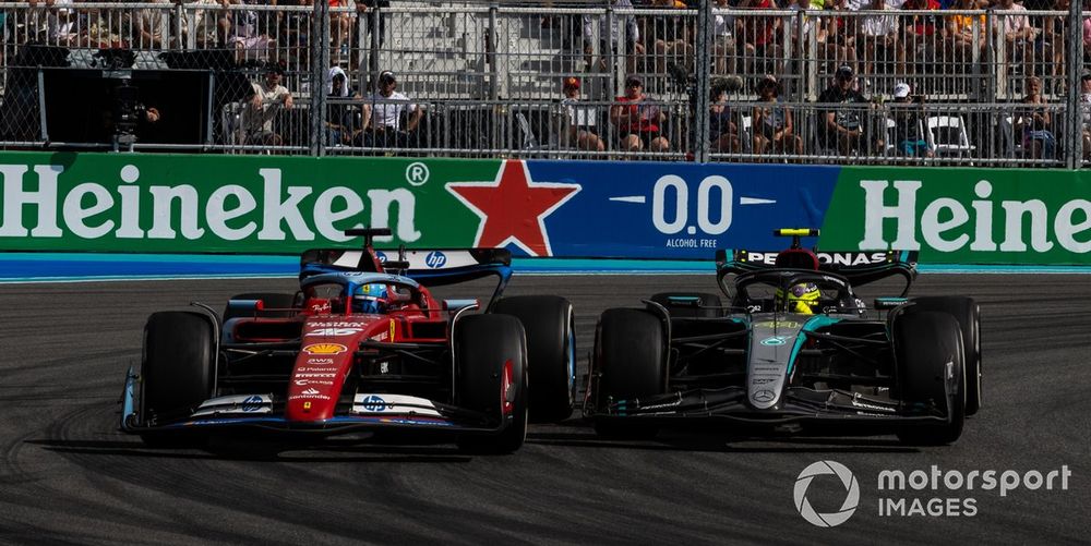 Charles Leclerc, Ferrari SF-24, battles with Sir Lewis Hamilton, Mercedes F1 W15