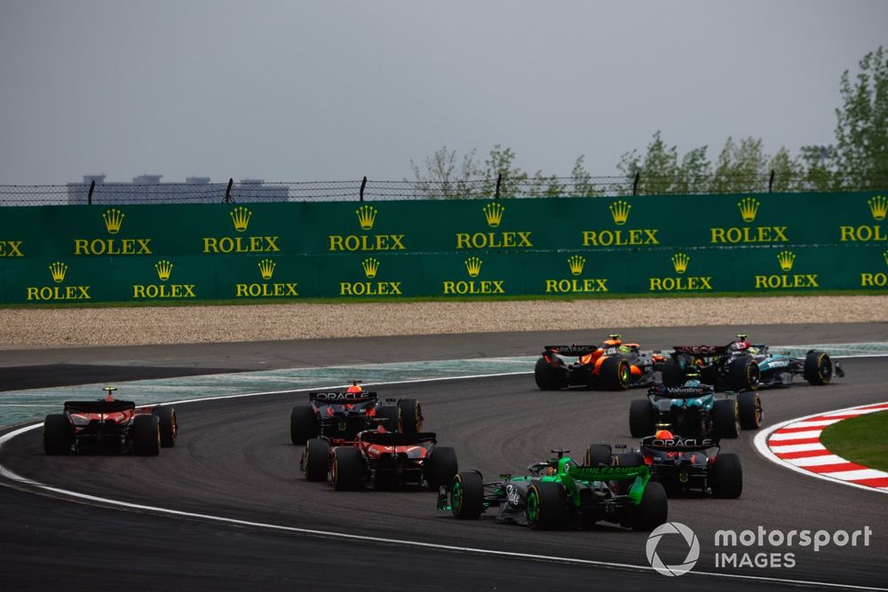 Sir Lewis Hamilton, Mercedes F1 W15, leads Lando Norris, McLaren MCL38, Fernando Alonso, Aston Martin AMR24, Max Verstappen, Red Bull Racing RB20, and the rest of the field at the start of the Sprint